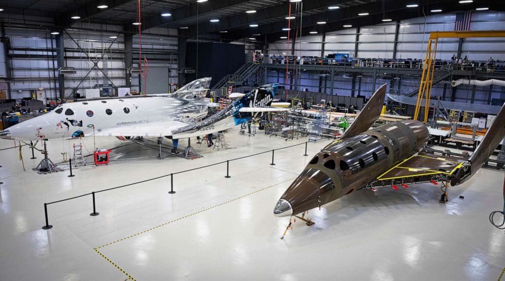 PHOTO: This photo released by Virgin Galactic Wednesday, Jan. 8, 2020, shows Virgin Galactic's next passenger spaceship in a hangar at the company's Mojave Air & Space Port in Mojave, Calif.