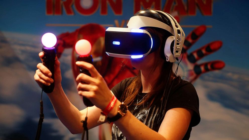 PHOTO: A gamer plays on a Playstation VR with virtual reality goggles and two controllers during Europe's leading digital games fair Gamescom, which showcases the latest trends of the computer gaming scene in Cologne, Germany, August 21, 2019.
