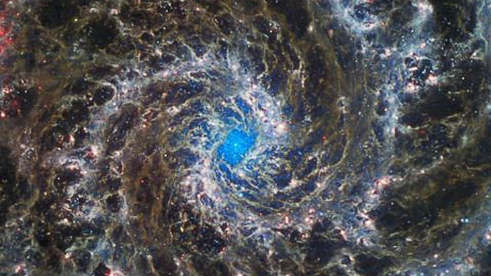 PHOTO: The hypnotizing swirls of the Phantom Galaxy are magnificent in any light. This image shows Webb's mid-infrared view.