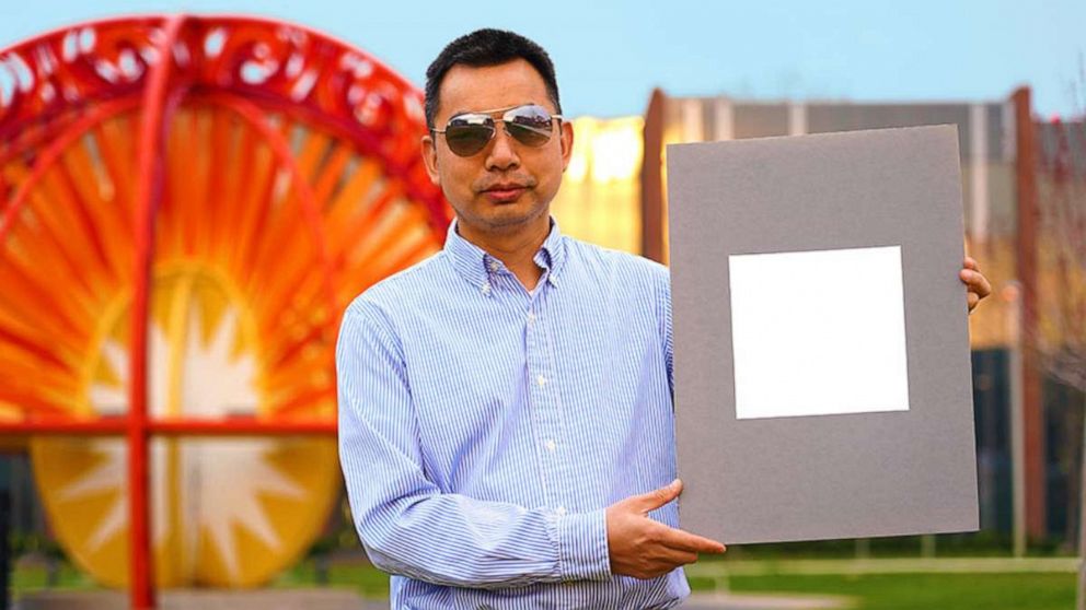 PHOTO: Xiulin Ruan, a Purdue University professor of mechanical engineering, holds up his lab’s sample of the whitest paint on record.
