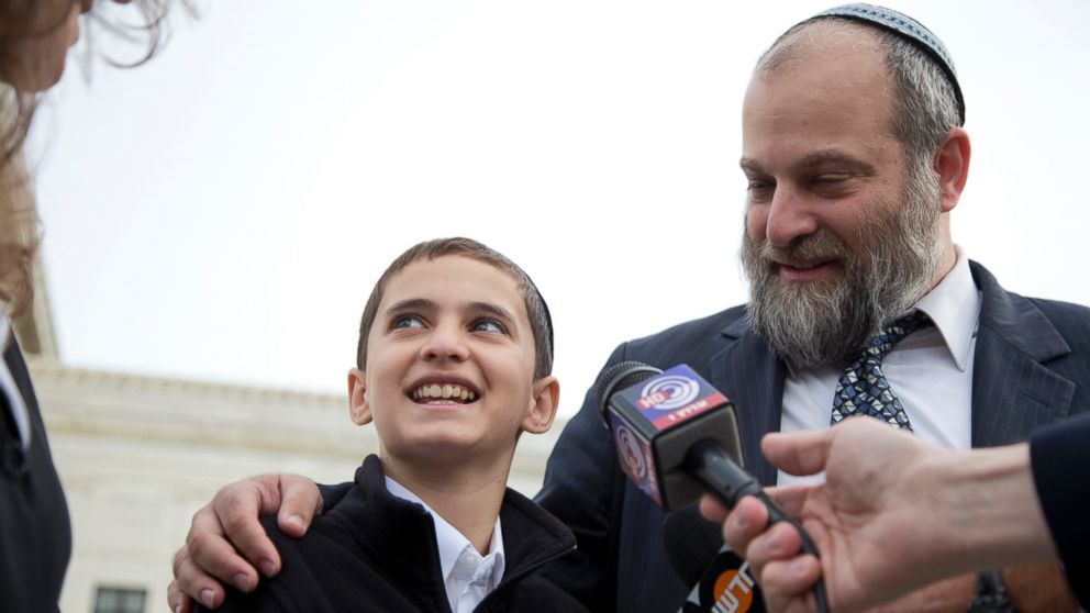 Menachem Zivotofsky and his father Ari Zivotofsky speak to the media outside the Supreme Court in Washington, Nov. 3, 2014. 