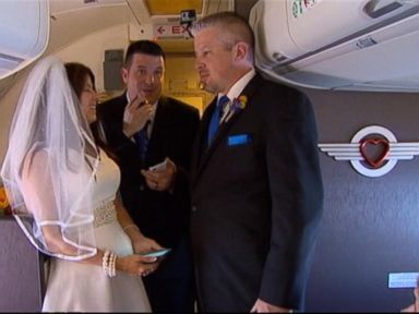 VIDEO: Dottie Coven and Keith Stewart read their vows at 32,000 ft. in order to make flying "fun again."