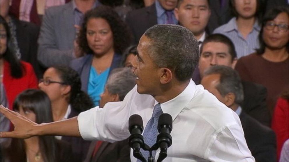 Heckler behind Obama steals attention away from president's speech.