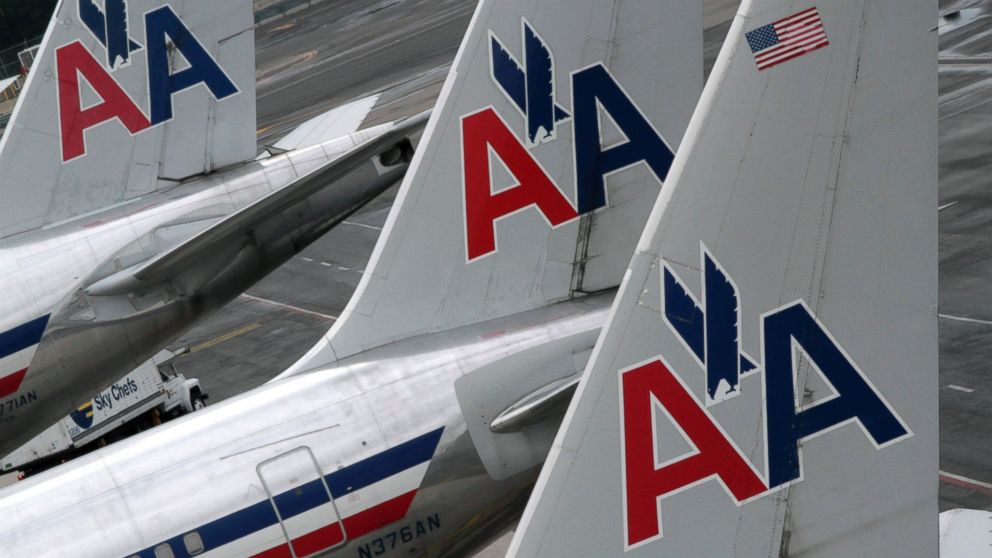 American Airlines airplanes are at parked at the gate at JFK International airport in this file photo, Aug.1, 2012, in New York.  