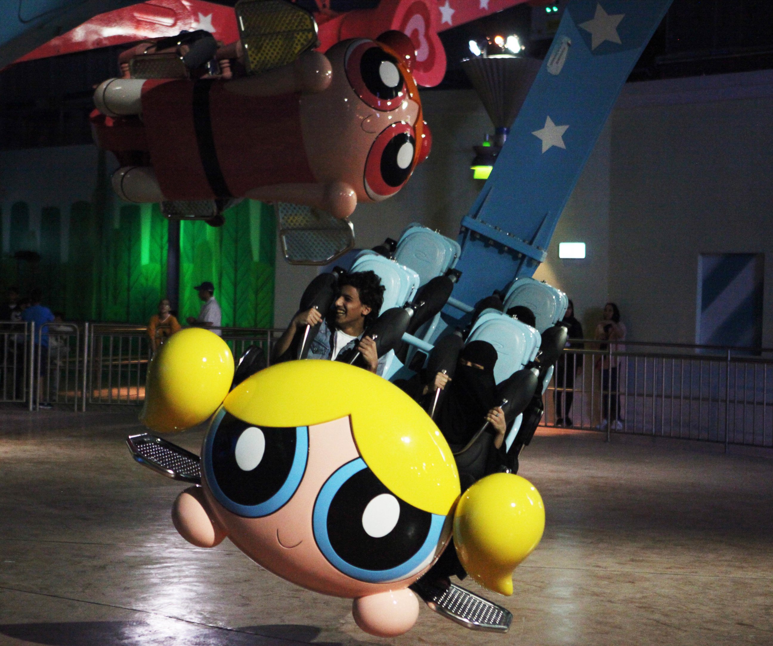 PHOTO:People shout as they experience the Powerpuff Girls - Mojo Jojo's Robot Rampage ride at the IMG Worlds of Adventure amusement park in Dubai, United Arab Emirates.