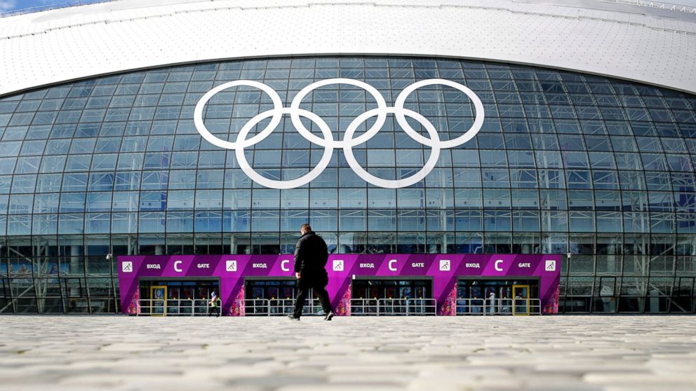 A man walks toward the Bolshoy Ice Dome, which is venue for Ice Hockey matches ahead of the 2014 Winter Olympics, Feb. 5, 2014, in Sochi, Russia.