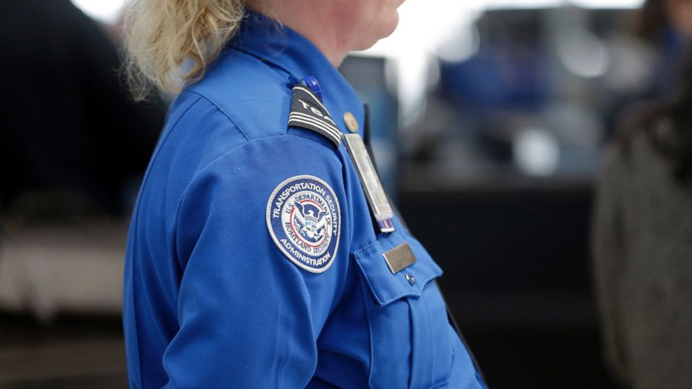 A Transportation Security Administration inspector works at a security checkpoint at Lambert-St. Louis International Airport, April 12, 2016, in St. Louis. 