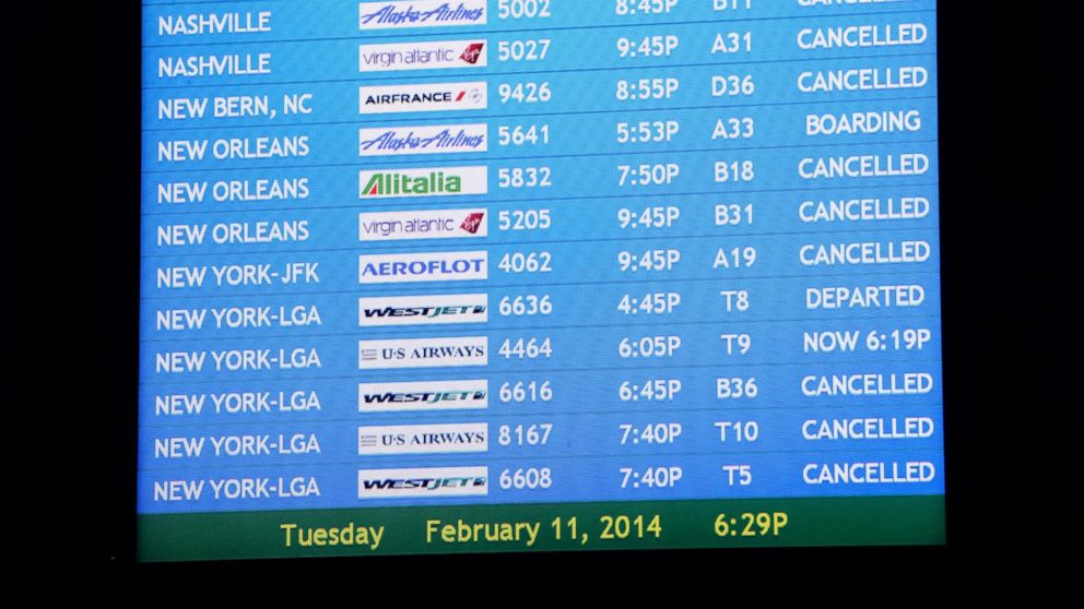 Delta Air Lines cancelled hundreds of flights and Southwest Airlines suspended most operations into and out of Hartsfield-Jackson International Airport, Feb. 11, 2014, in Atlanta. 