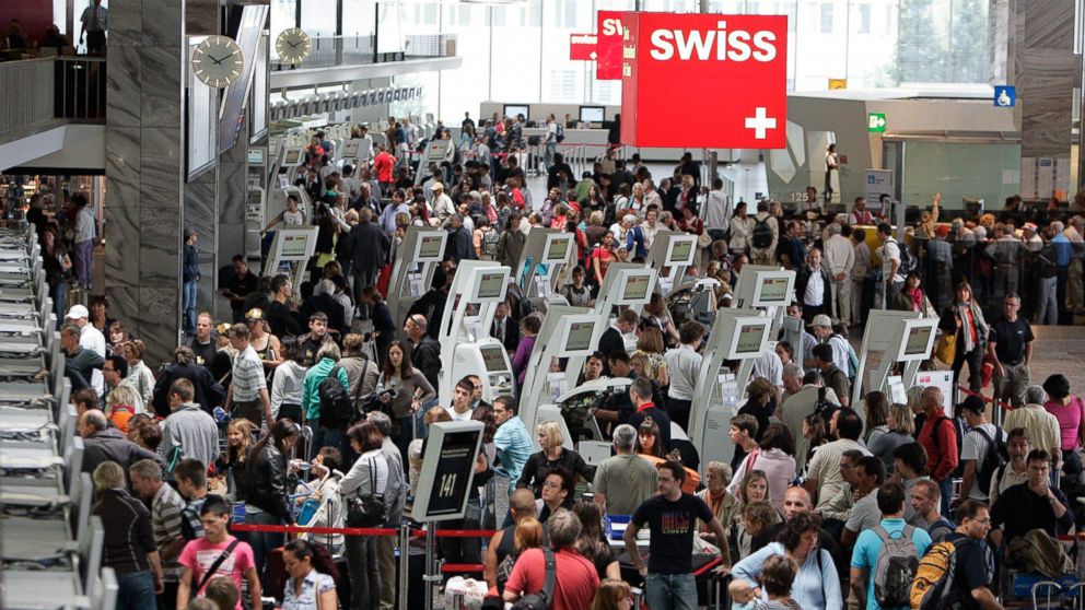 PHOTO: Passengers gather at the Zurich Airport in Kloten, Switzerland, July 11, 2009.