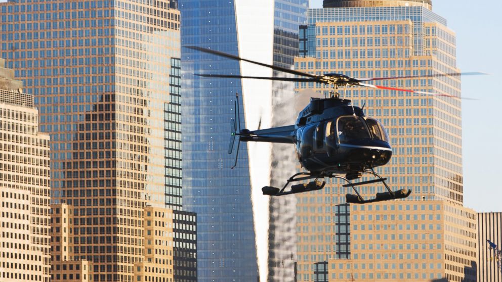 Close up of helicopter and office buildings in New York City.