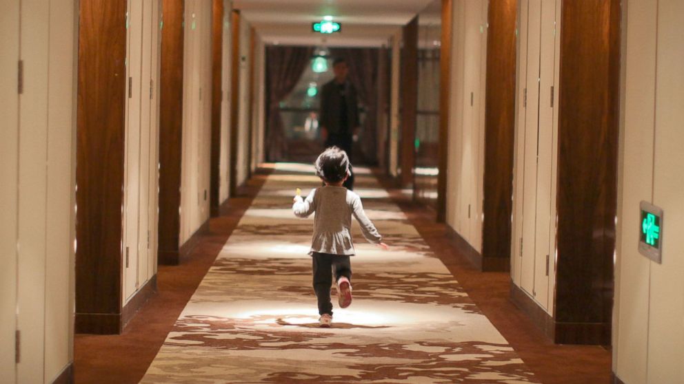 Child running in the hotel corridor.