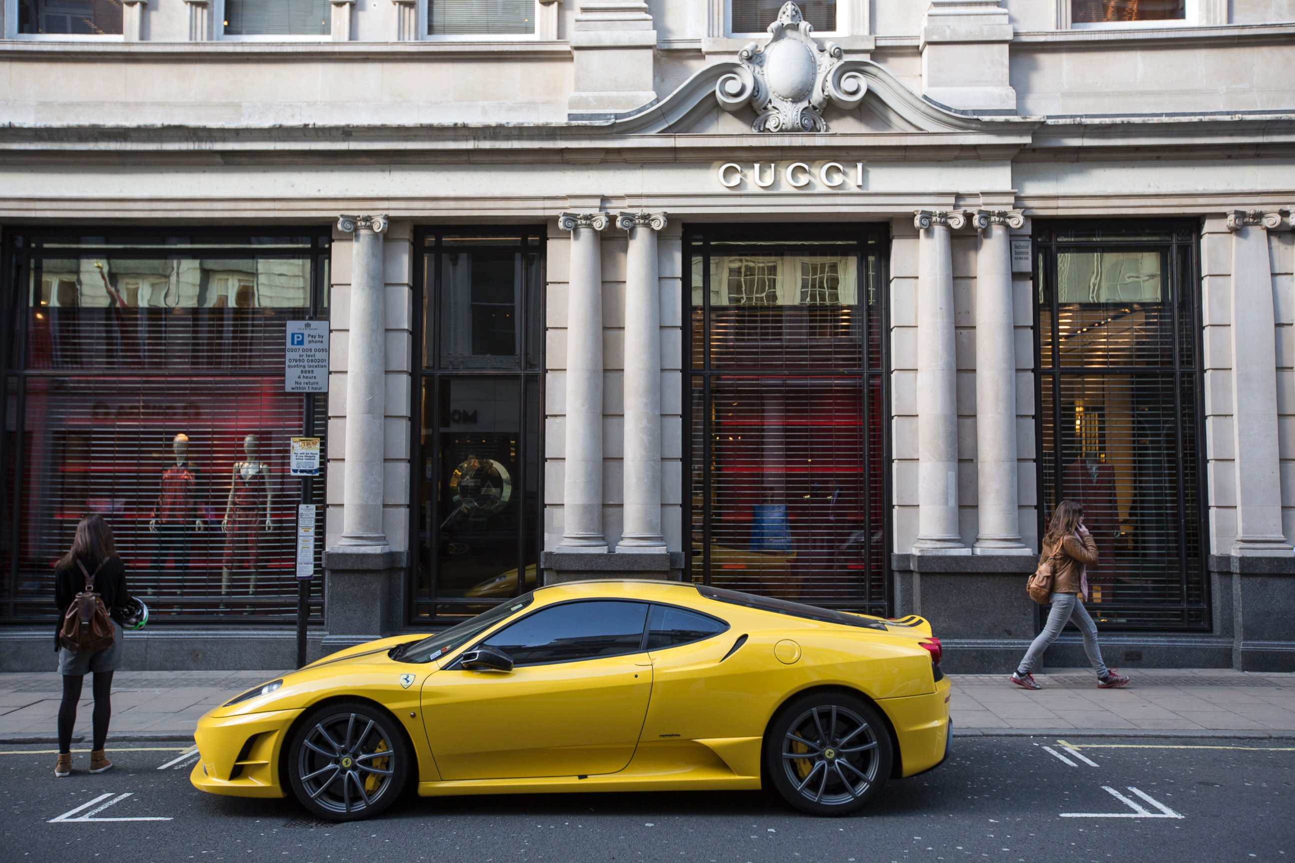 PHOTO: A yellow Lamborghini is parked outside Gucci on Old Bond Street on April 15, 2014 in London, England.