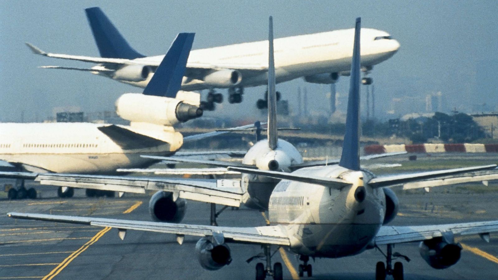 PHOTO: Airplanes wait to takeoff on the tarmac.