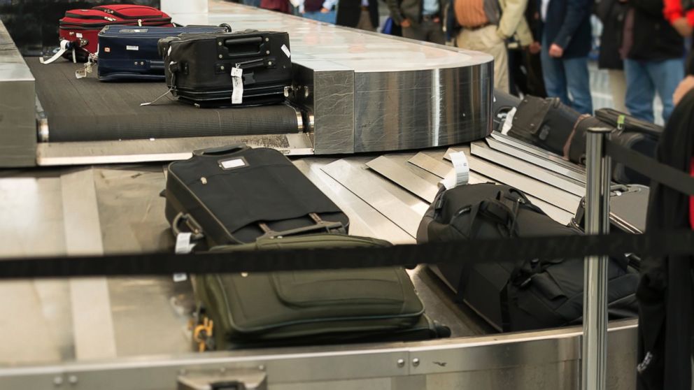 PHOTO: Passengers wait at the baggage claim conveyor belt at Philadelphia International Airport, Nov. 10, 2013.