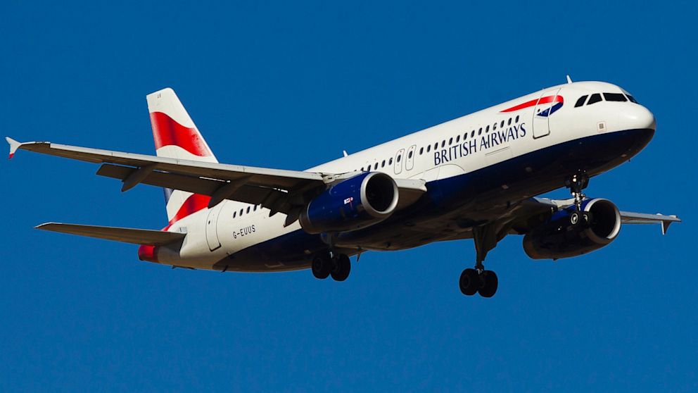 A British Airways passenger jet prepares to land at Madrid Barajas airport in Madrid, Spain, Aug. 6, 2013. 