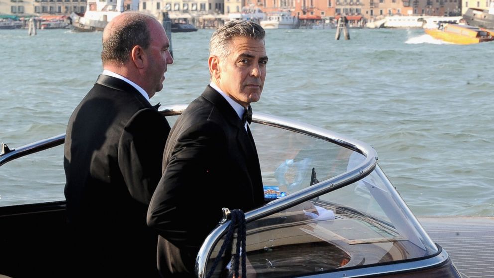 PHOTO: George Clooney, right, is seen during the 70th Venice International Film Festival on Aug. 28, 2013 in Venice, Italy.  