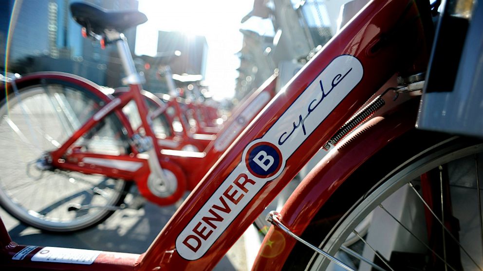 B-Cycle bikes sit on a rack in Denver.