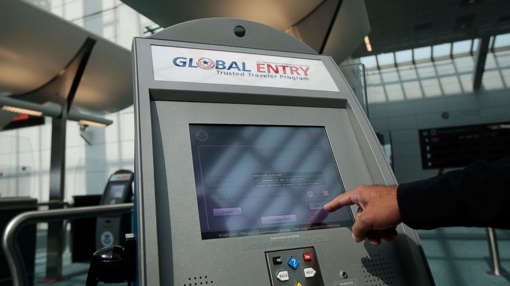 An officer with the U.S. Customs and Border Protection demonstrates a new arrivals processing kiosk at Newark International Airport in this Aug. 24, 2009, file photo in Newark.