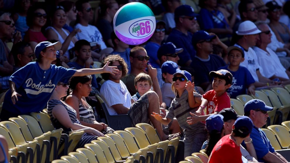 Young Los Angeles Dodgers fans toss around an inflatable beach ball in the stands during the MLB game between the Colorado Rockies and the Los Angeles Dodgers at Dodger Stadium in Los Angeles, Aug. 28, 2011.