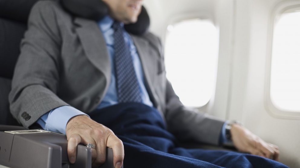 PHOTO: Nervous passenger sitting on airplane