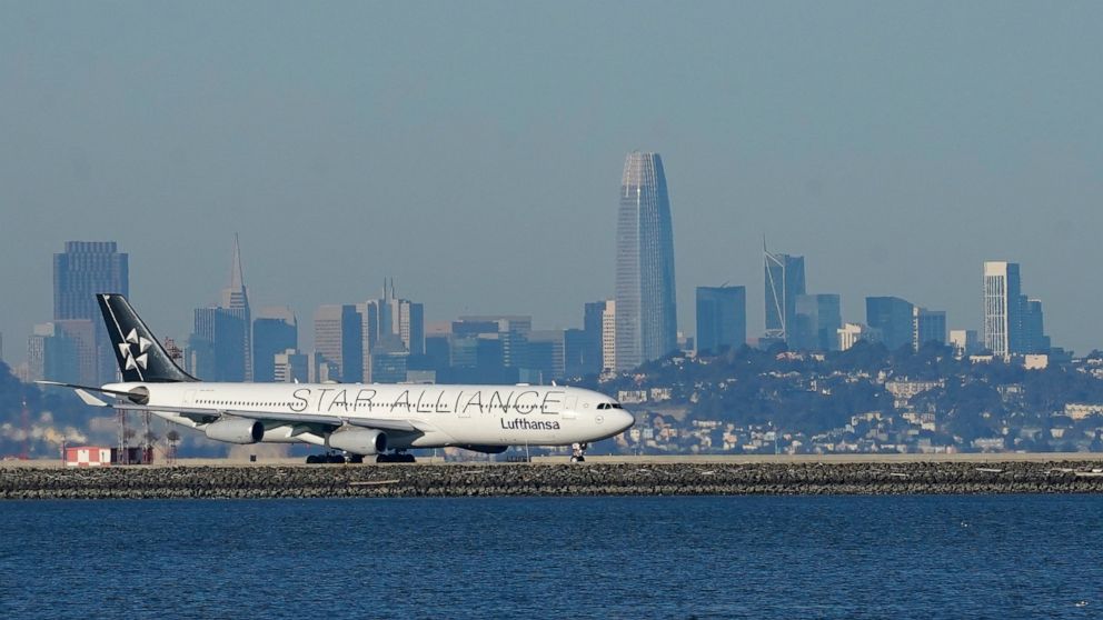 FILE - In this Tuesday, Dec. 22, 2020 file photo, A Lufthansa Star Alliance plane prepares to take off at San Francisco International Airport during the coronavirus pandemic in San Francisco. he hack of a company that manages ticket-processing and fr