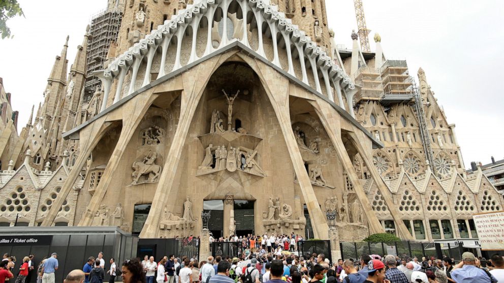 FILE - In this Sunday, Aug. 20, 2017 file photo, dignitaries leave after a Mass at Barcelona's Sagrada Familia Basilica for the victims of the terror attacks, in Barcelona, Spain. Barcelona’s breathtaking La Sagrada Familia Basilica designed by archi