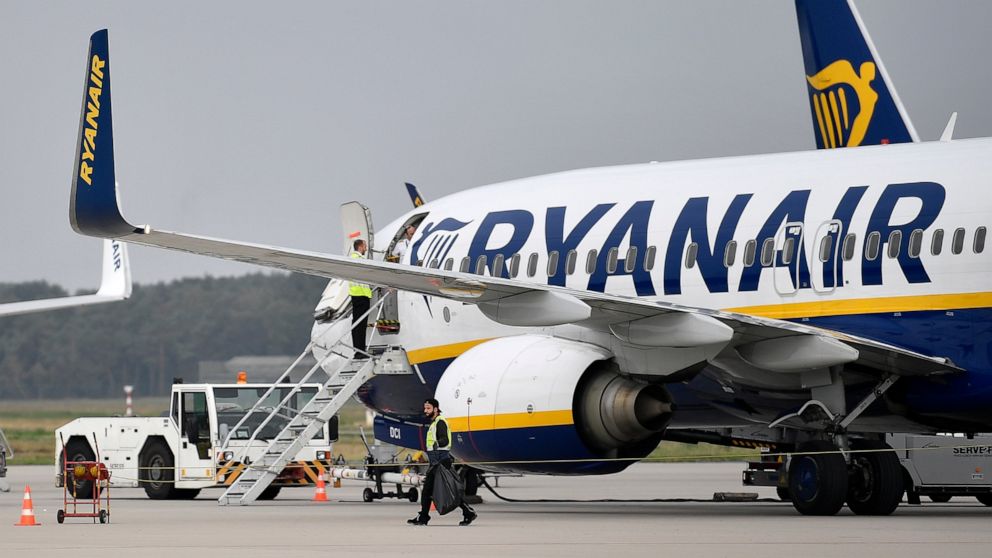 FILE - A Ryanair plane parks at the airport in Weeze, Germany, Sept. 12, 2018. Budget airline Ryanair says it's forcing South African travellers to the U.K. to do a test in the Afrikaans language to prove their nationality in an apparent effort to we