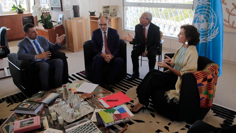 Governor of the province Nineveh Mansour al-Mareed, left, and Iraq's Culture Minister Abdulamir al-Dafar Hamdani, center, meet UNESCO'S Director-General Audrey Azoulay at the UNESCO's headquarters in Paris, Wednesday, Sept. 11. 2019. Iraqi officials 