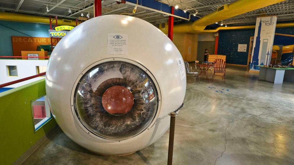 In this Tuesday, June 25, 2019 photo, a giant eyeball sits on the second floor of the Children's Museum of Illinois in Decatur, Ill. The exhibit is the idea of Dr. John Lee, a local ophthalmologist. He designed it hoping that if people know more abou