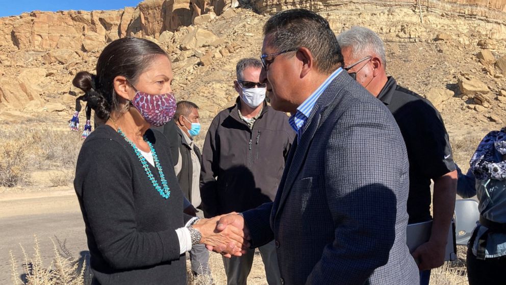 FILE - Hopi Vice Chairman Clark Tenakhongva, right, talks to UnitedStates Interior Secretary Deb Haaland after a celebration at Chaco Culture National Historical Park in northwestern New Mexico, Nov. 22, 2021. The Biden administration's approval of o