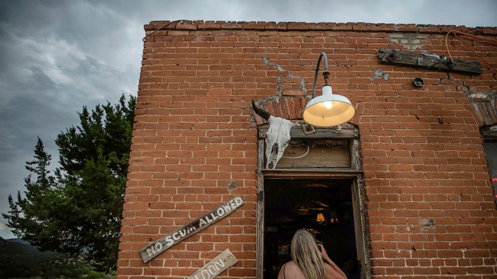 In this June 13, 2019 photo, the No Scum Allowed Saloon can be found in White Oaks, which is a ghost town in Lincoln County, N.M. The Albuquerque Journal reports the No Scum Allowed Saloon pulls in people from around the state and sometimes tourists 