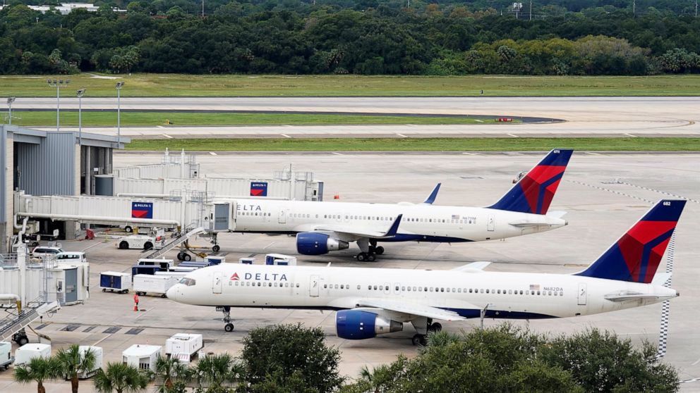 A Delta Airlines Boeing 757 pushes back from the gate at the Tampa International Airport Tuesday, Sept. 27, 2022, in Tampa, Fla. The airport is closing at 5pm today ahead of a potential landfall by Hurricane Ian. Ian is predicted to hit somewhere alo