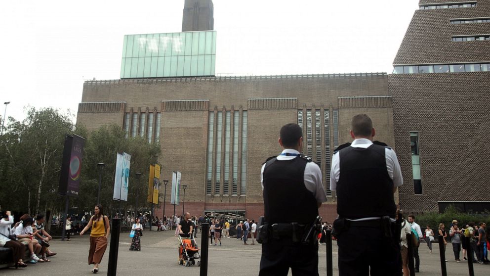 Emergency crews attending a scene at the Tate Modern art gallery, London, Sunday, Aug. 4, 2019. London police say a teenager was arrested after a child "fell from height" at the Tate Modern art gallery. The Metropolitan Police Service said on Twitter