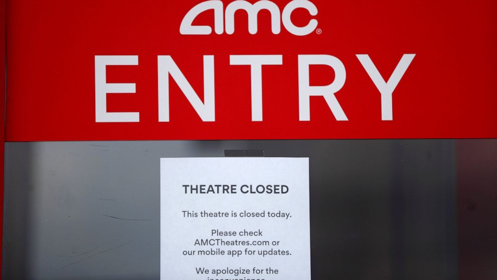 A closed sign is displayed on an AMC Theatre in Clinton Township, Mich., Friday, May 8, 2020. All AMC theatres are temporarily closed due to the coronavirus pandemic. (AP Photo/Paul Sancya)