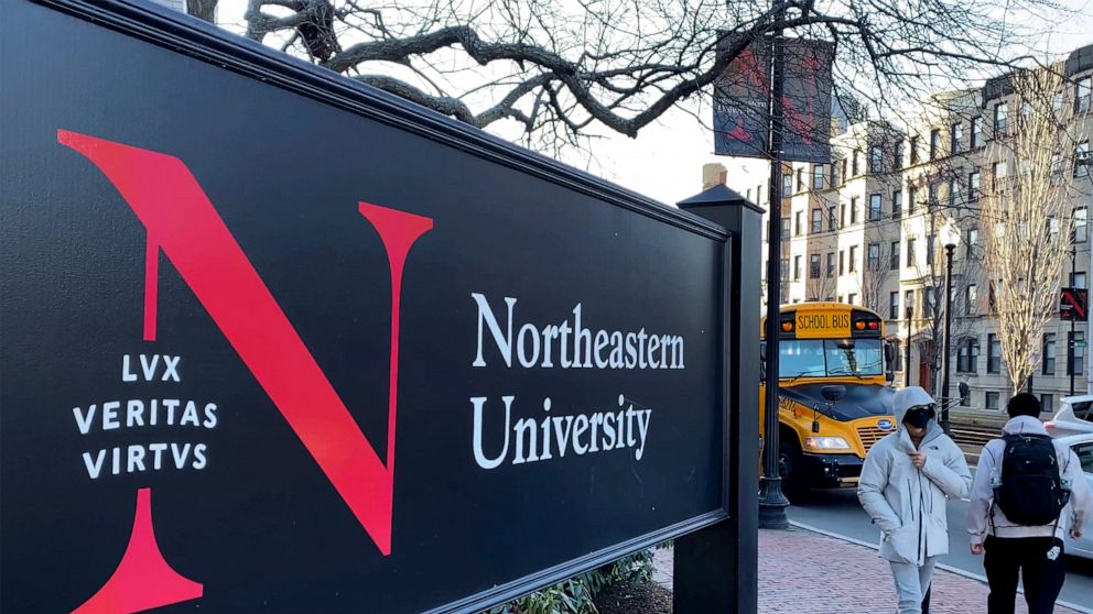 FILE - Students walk on the Northeastern University campus in Boston on Jan. 31, 2019. A police bomb squad sealed off part of the campus of Northeastern University late Tuesday, Sept. 13, 2022, to examine a pair of suspicious packages, and there were