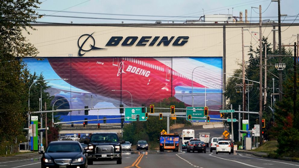 FILE - In this Oct. 1, 2020 file photo, traffic passes the Boeing airplane production plant, in Everett, Wash. U.S. manufacturers expanded in March 2021 at the fastest pace in 37 years, a sign of strengthening demand as the pandemic wanes and governm