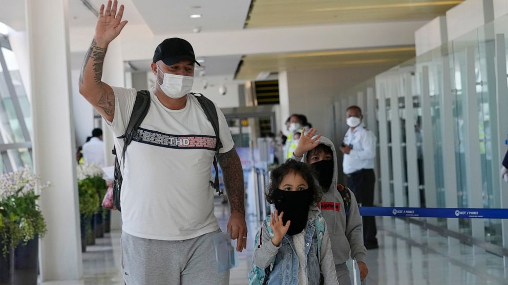 The first group of tourists arrive on an Etihad flight from Abu Dhabi at the Phuket International Airport in Phuket, Thailand, Thursday, July 1, 2021. Starting Thursday, Thailand is welcoming back international visitors — as long as they are vaccinat