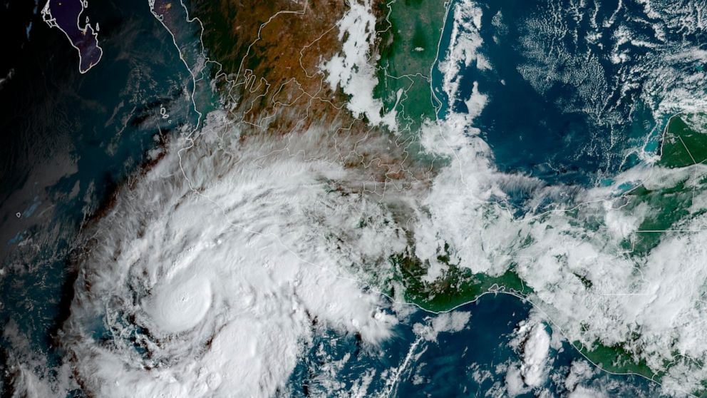 This satellite image taken at 10am ET and provided by NOAA shows Tropical Storm Roslyn approaching the Pacific coast of Mexico, Friday, Oct. 21, 2022. Forecasters expect it to be a hurricane when it makes a likely weekend landfall between the resorts