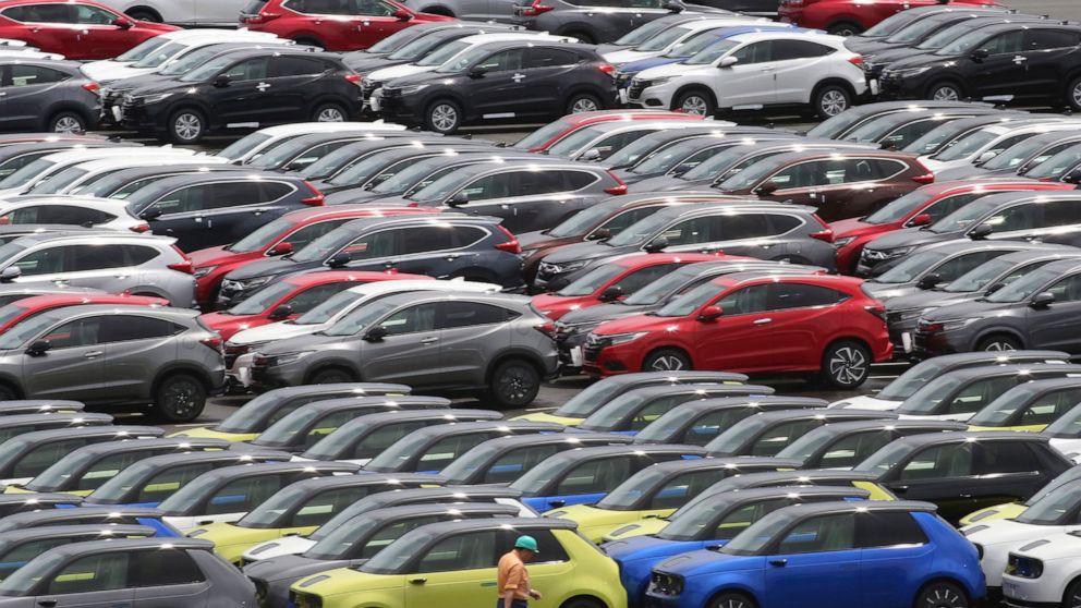Cars for export park at a port in Yokohama, near Tokyo on July 6, 2020. Japan recorded a trade deficit in April as imports ballooned 28% as energy prices soared following the war in Ukraine, according to Ministry of Finance data released Thursday, Ma
