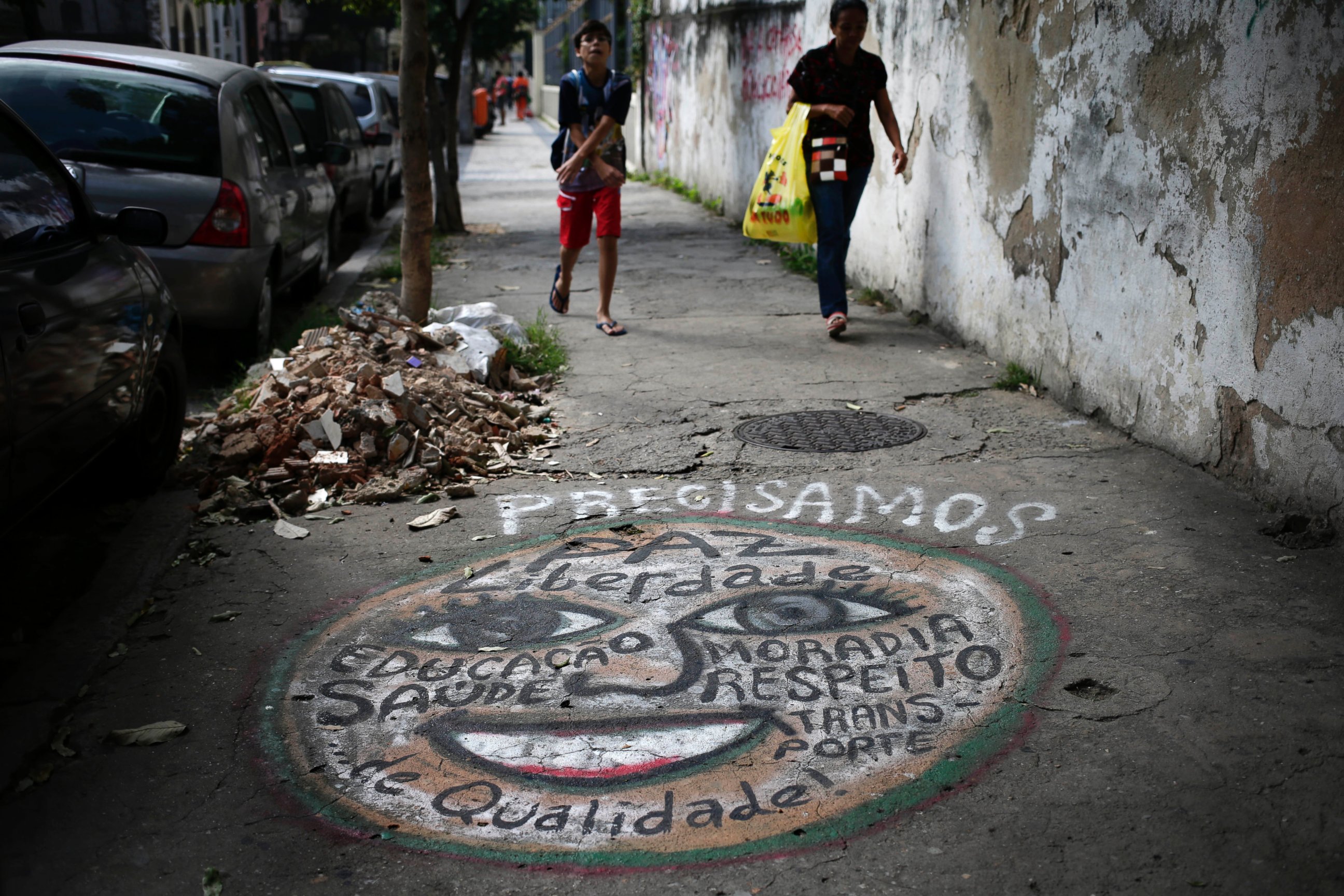 PHOTO: A mural that lists many wants including better quality health care, peace, freedom, homes and transportation, adorns a sidewalk in Rio de Janeiro, Brazil, May 21, 2014.