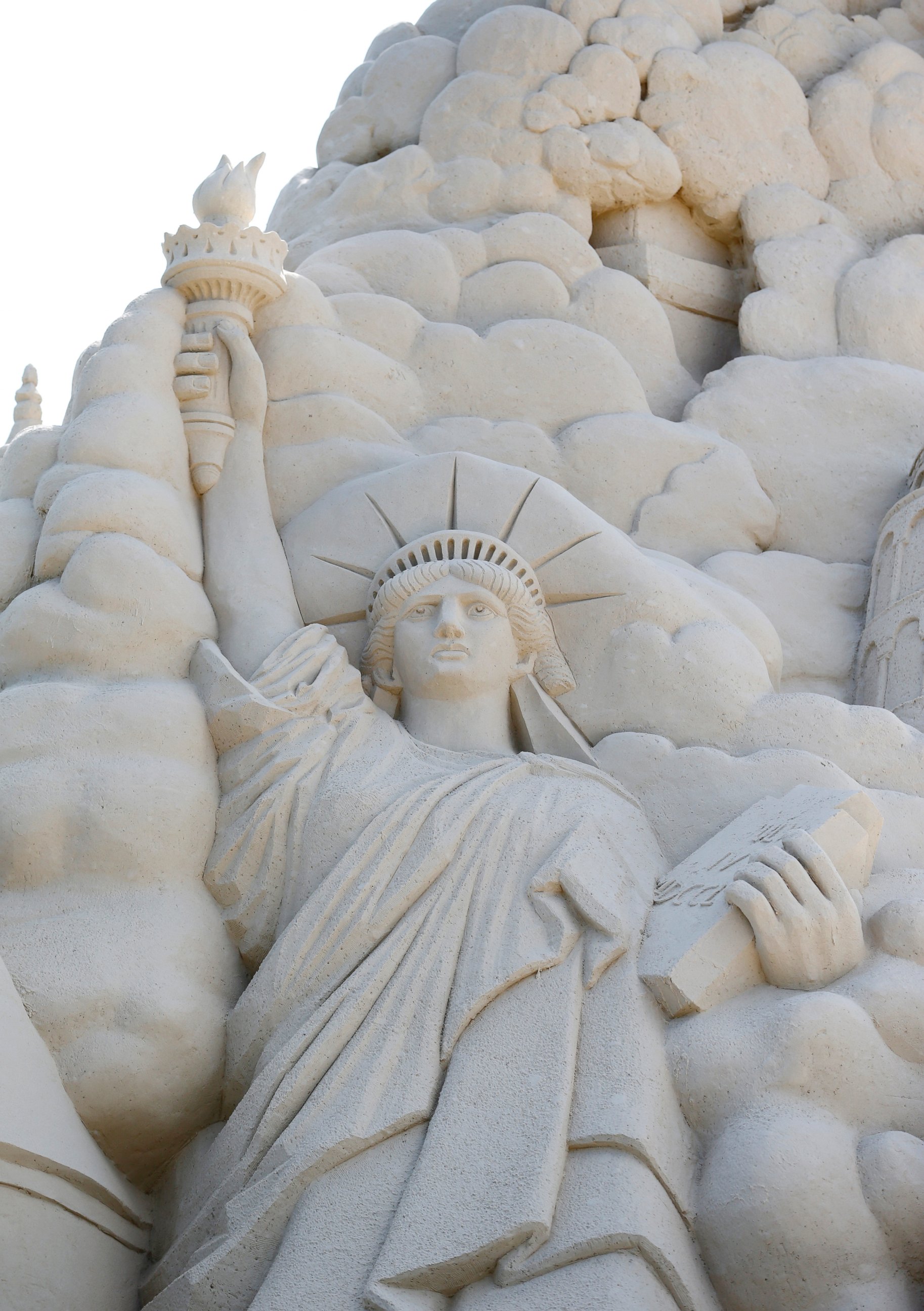 PHOTO: A detail of the Statue of Liberty is carved into the side of a sand castle, built in a record attempt for the tallest sand castle, is Monday, Oct. 26, 2015, on Virginia Key Beach in Miami.