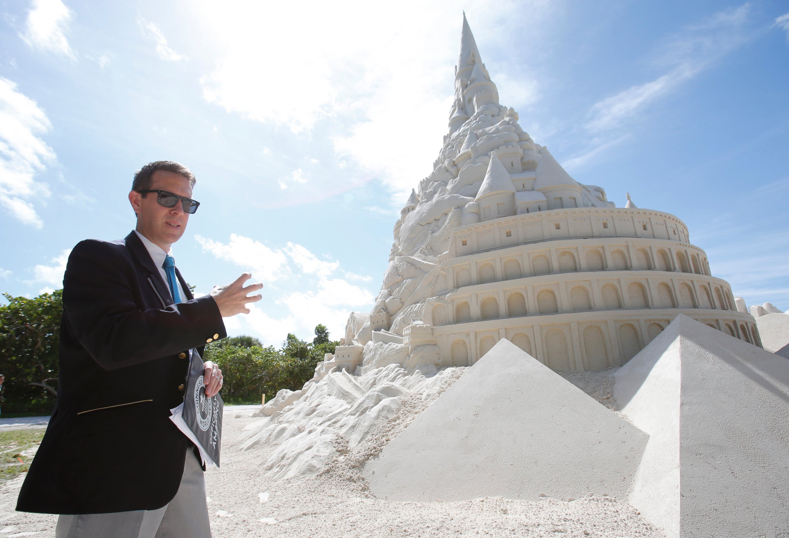 PHOTO: Guinness World Records Limited adjudicator Philip Robertson explains the criteria needed for a record attempt to build the tallest sand castle, Oct. 26, 2015, on Virginia Key Beach in Miami. 
