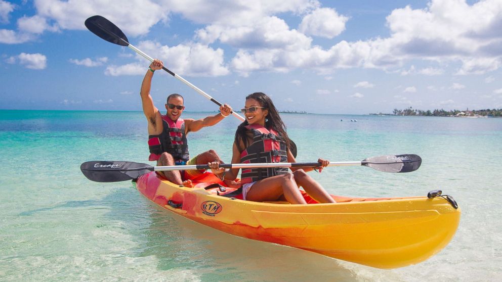 PHOTO: A man and woman use a kayak in a promotional photo for Breezes Resort & Spa in the Bahamas.