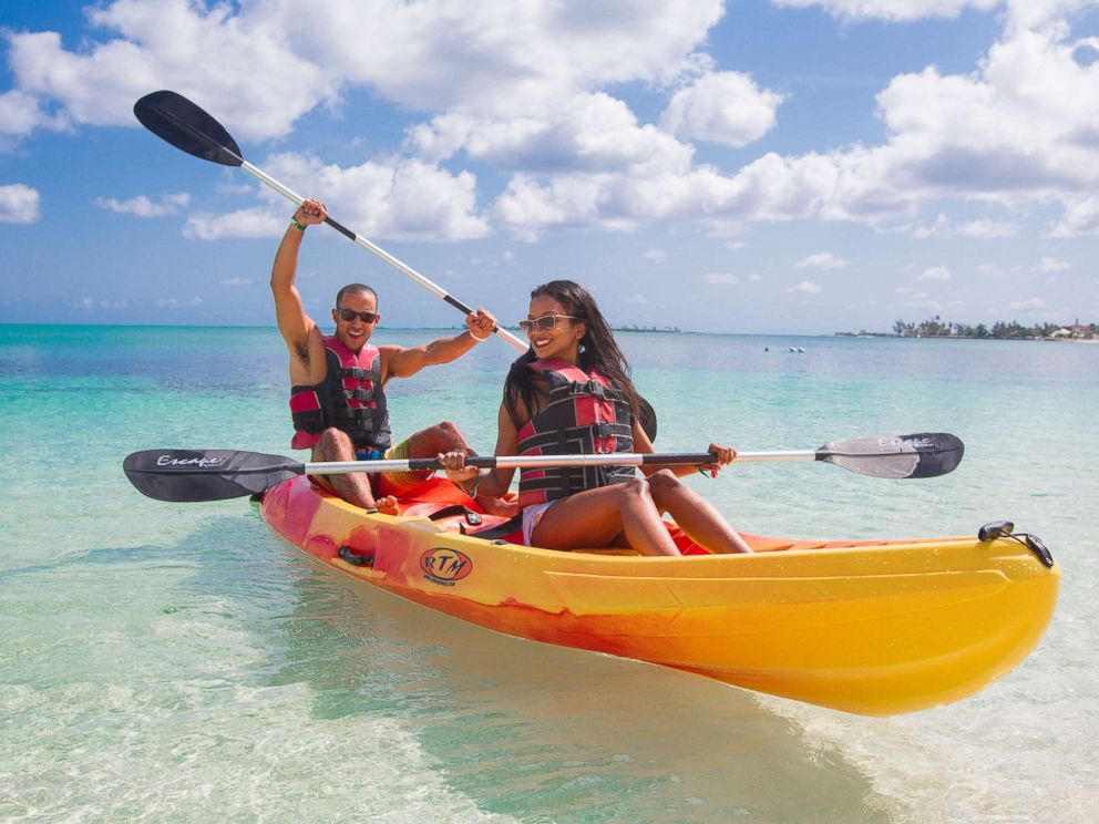 PHOTO: A man and woman use a kayak in a promotional photo for Breezes Resort & Spa in the Bahamas.