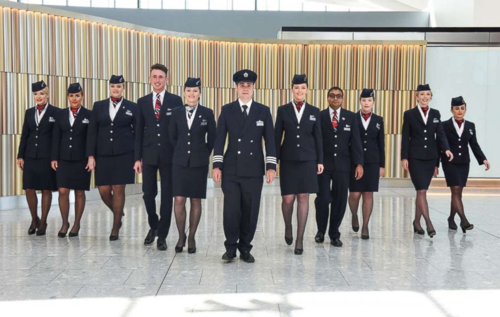 British Airways cabin crew, all named Harry or Meghan, who will be operating today's Heathrow to Toronto flight in celebration of the Royal Wedding at Heathrow Airport on May 19, 2018 in London, England.