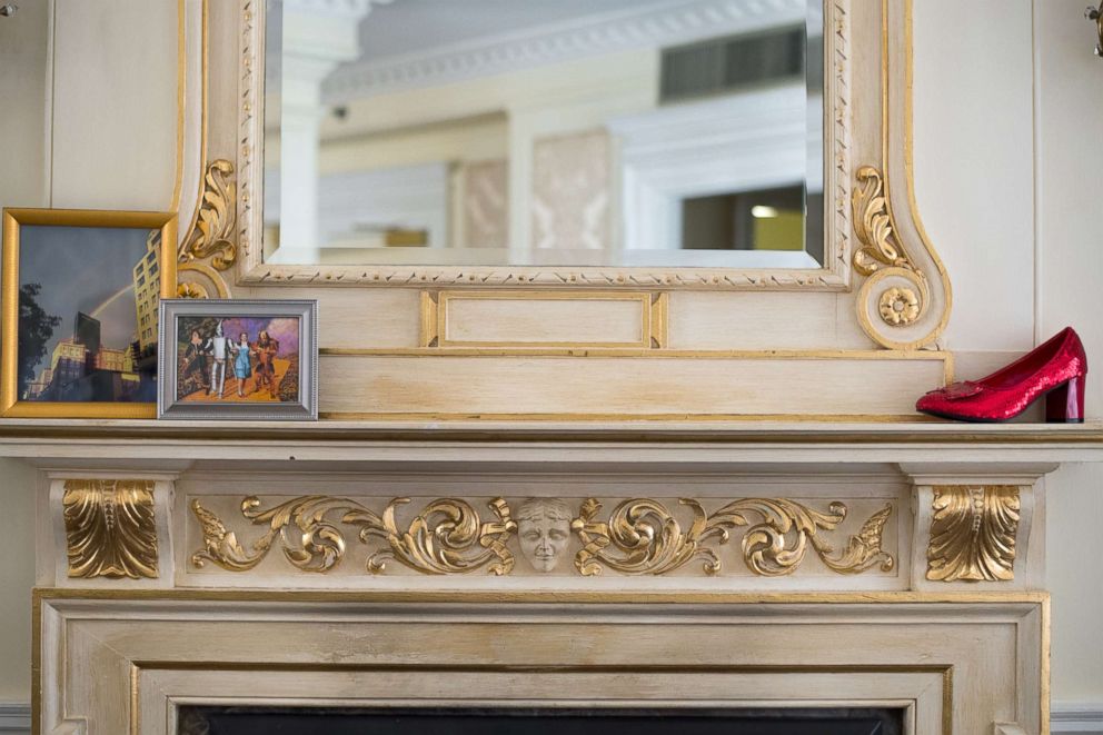 PHOTO: A replica of the famous ruby slipper sits atop the fireplace in the Judy Garland Suite at the Lenox Hotel in Boston.