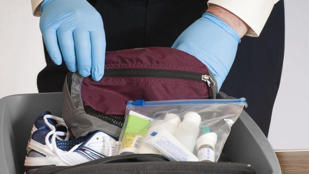 Airport security officer searches a bag in this undated stock image.