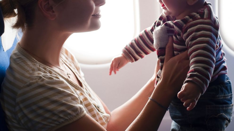 A Mother and her baby boy are playing on the plane in this file photo. 