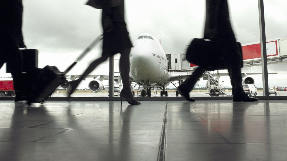 Travelers are pictured in an airport in this undated stock image.