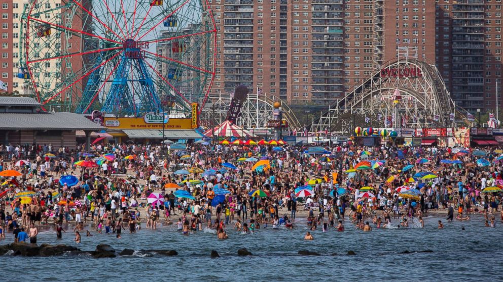 People crowd the beach at Coney Island on Memorial Day, May 26, 2014 in the Brooklyn borough of New York City.